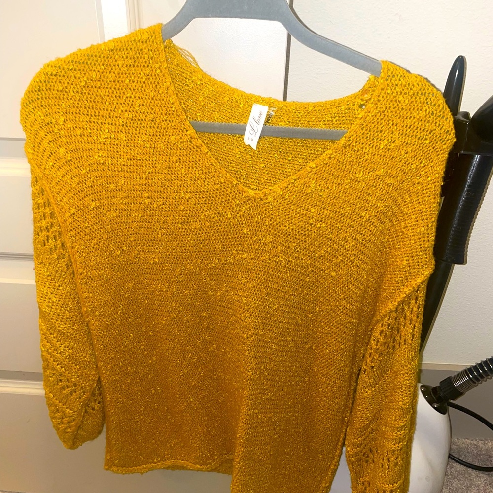 Yellow sweater with arm detailing. Never worn. Size small/medium.